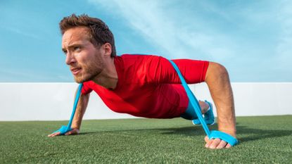 Man performing a resistance band push-up