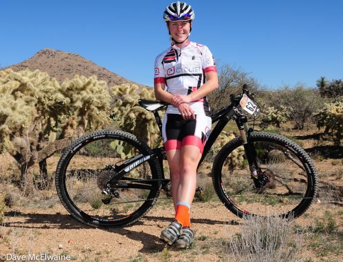 Chloe Woodruff (Competitive Cyclist) relaxing on her Niner before the start