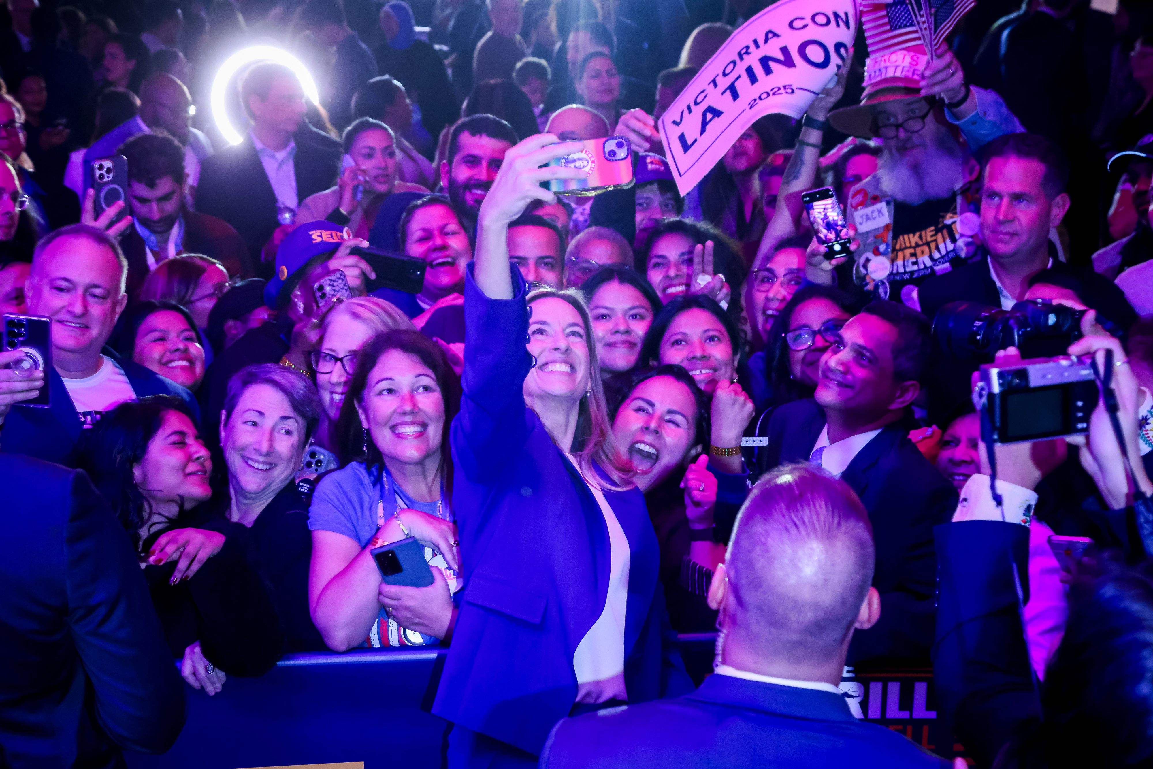 A candidate takes a selfie with supporters at an election-night event in New Jersey.