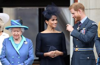 Queen Elizabeth II, Prince Harry, Duke of Sussex and Meghan, Duchess of Sussex on the balcony of Buckingham Palace