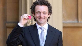 Actor Michael Sheen with the OBE he received earlier from Queen Elizabeth II during investitures at Buckingham Palace on June 2, 2009 in London, England.