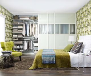 green bedroom with built-in wardrobe