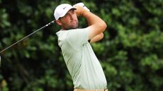 Scottie Scheffler takes a tee shot at the Tour Championship