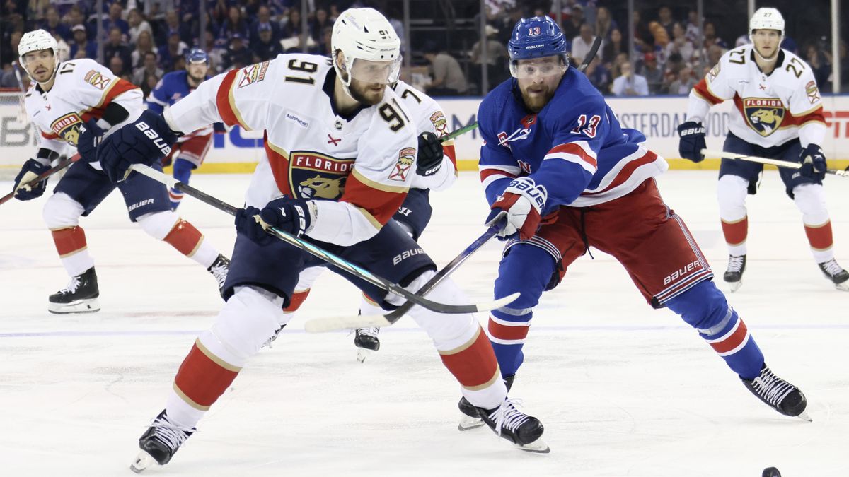  Alexis Lafrenière #13 of the New York Rangers battles against Oliver Ekman-Larsson #91 of the Florida Panthers during the second period in Game One of the Eastern Conference Final of the 2024 Stanley Cup Playoffs at Madison Square Garden on May 22, 2024 in New York City. 