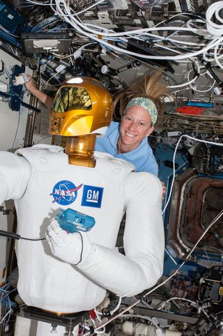 Astronaut Nyberg and Robonaut 2