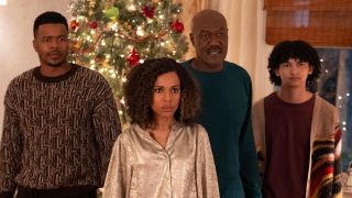 Paige, Edwin, Finn and Mal in front of Christmas tree in UnPrisoned Season 2