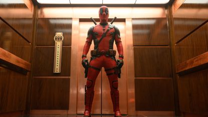 Ryan Reynolds as Deadpool standing in the TVA during the Marvel movie Deadpool & Wolverine.