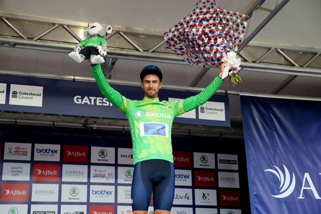 GATESHEAD ENGLAND SEPTEMBER 10 Jacob Scott of United Kingdom and Team Canyon DHB Sungod celebrates winning the green mountain jersey on the podium ceremony after the 17th Tour of Britain 2021 Stage 6 a 198km stage from Carlisle to Gateshead TourofBritain TourofBritain on September 10 2021 in Gateshead England Photo by Alex LiveseyGetty Images