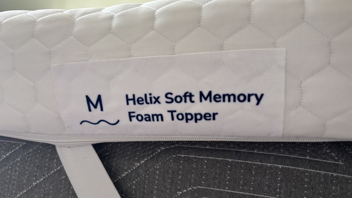 A close-up look at the logo of the Helix Premium Memory Foam Mattress Topper with GlacioTex.