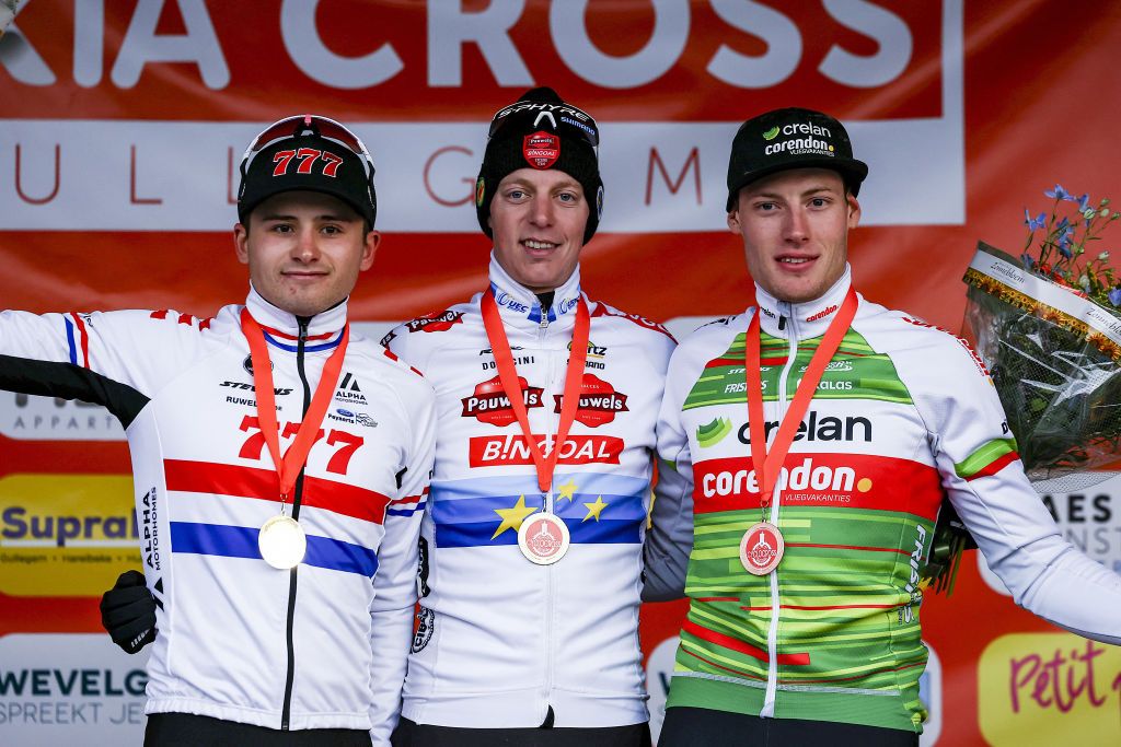 LtR, Second placed British Cameron Mason, winner Belgian Michael Vanthourenhout and third placed Belgian Joran Wyseure pose on the podium at the end of the Men's Elite race at the UCI World Cup cyclocross competition in Gullegen on January 6, 2024. (Photo by DAVID PINTENS / Belga / AFP) / Belgium OUT