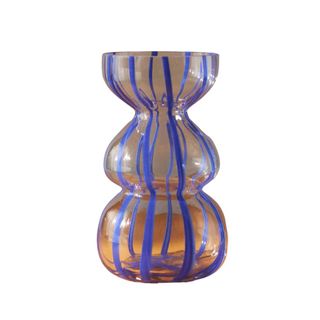 A cobalt blue striped glass vase