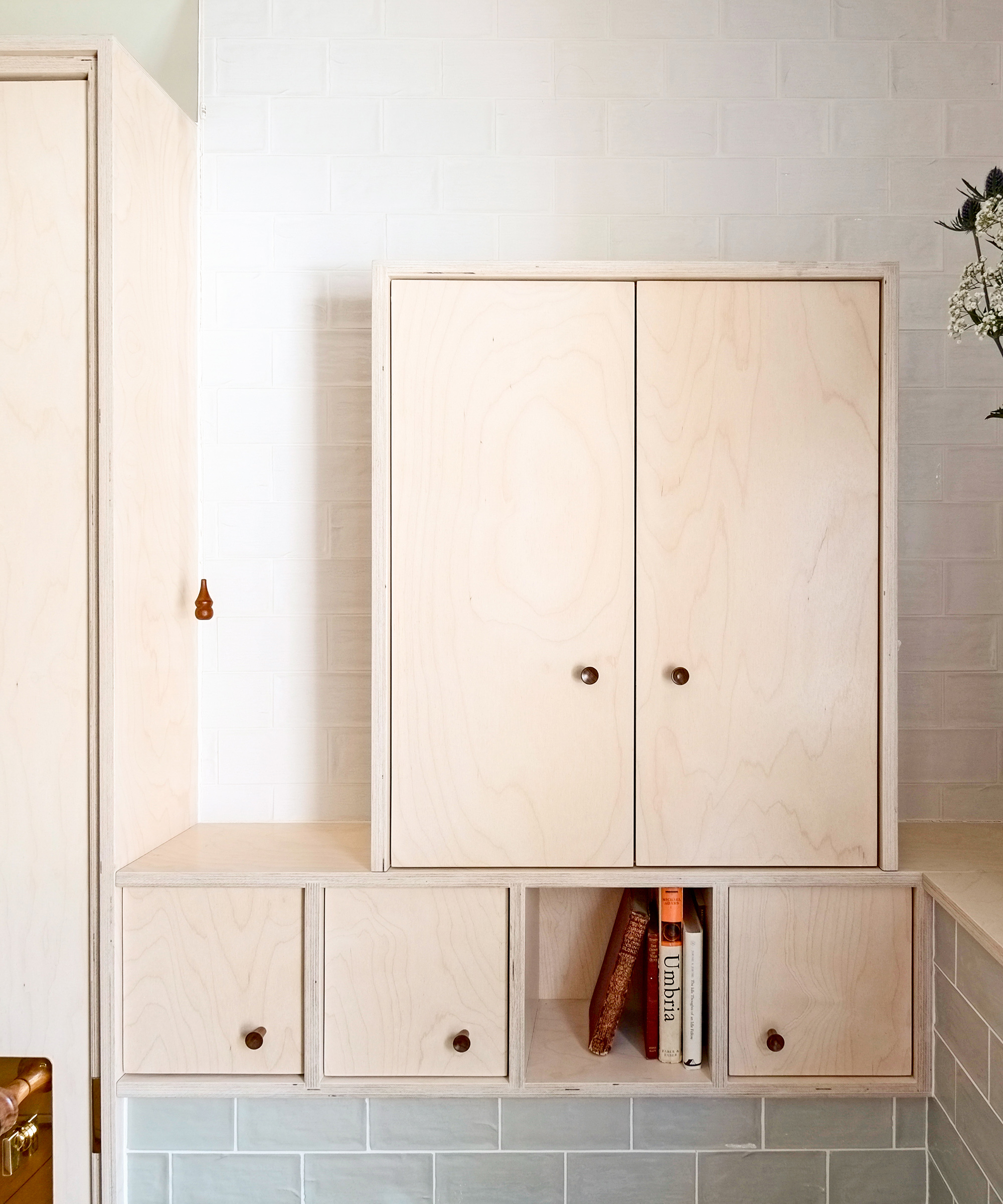Birch plywood storage in a bathroom