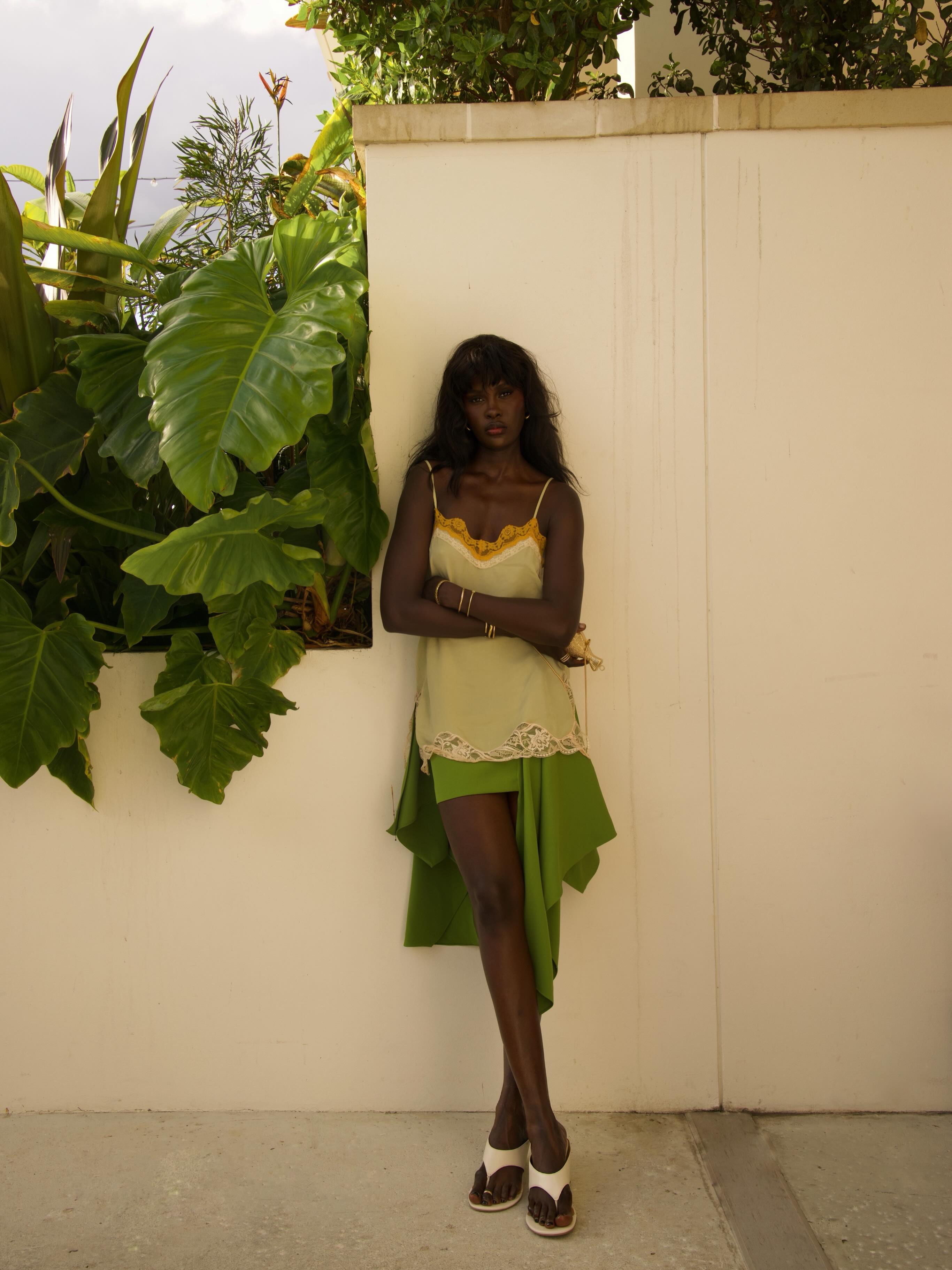 An image of a woman wearing green apple color trend summer 2026