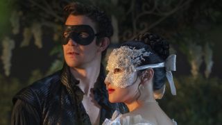 Benedict and Sophie in costume masks in Bridgerton Season 4 premiere