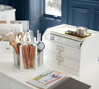 A white desk with two drawer desk organizer and clear acrylic Lazy Susan