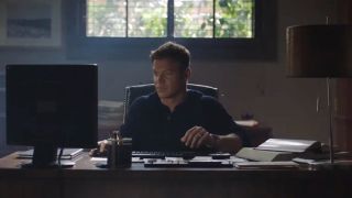 Matt Passmore sits working at a desk in his study in Jigsaw.