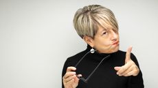 Portrait of angry woman against white background - stock photo.