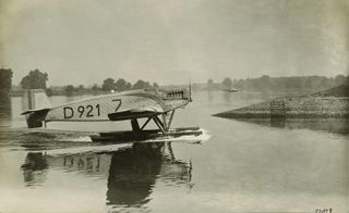 Black & white photo of the original Junkers aircraft drifting on the river.