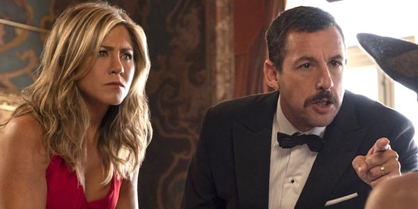 Netflix Murder Mystery Jennifer Aniston Adam Sandler points in tuxedo