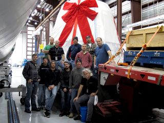 SpaceX Dragon spacecraft wrapped like a gift.