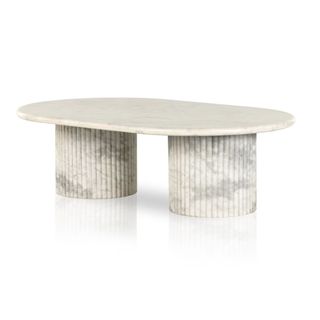 A marble coffee table with two wide legs