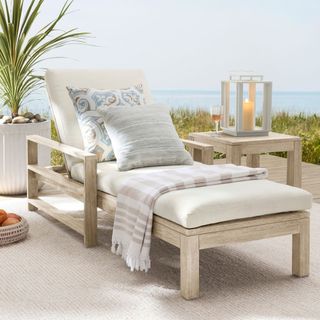 Indio Eucalyptus Single Outdoor Chaise Lounge on a patio with a sea view. 