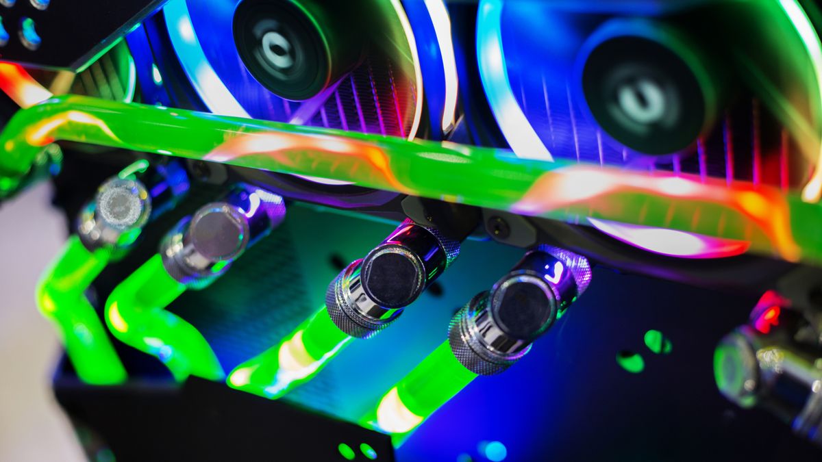 A close up shot of a graphics card and water block in a gaming PC