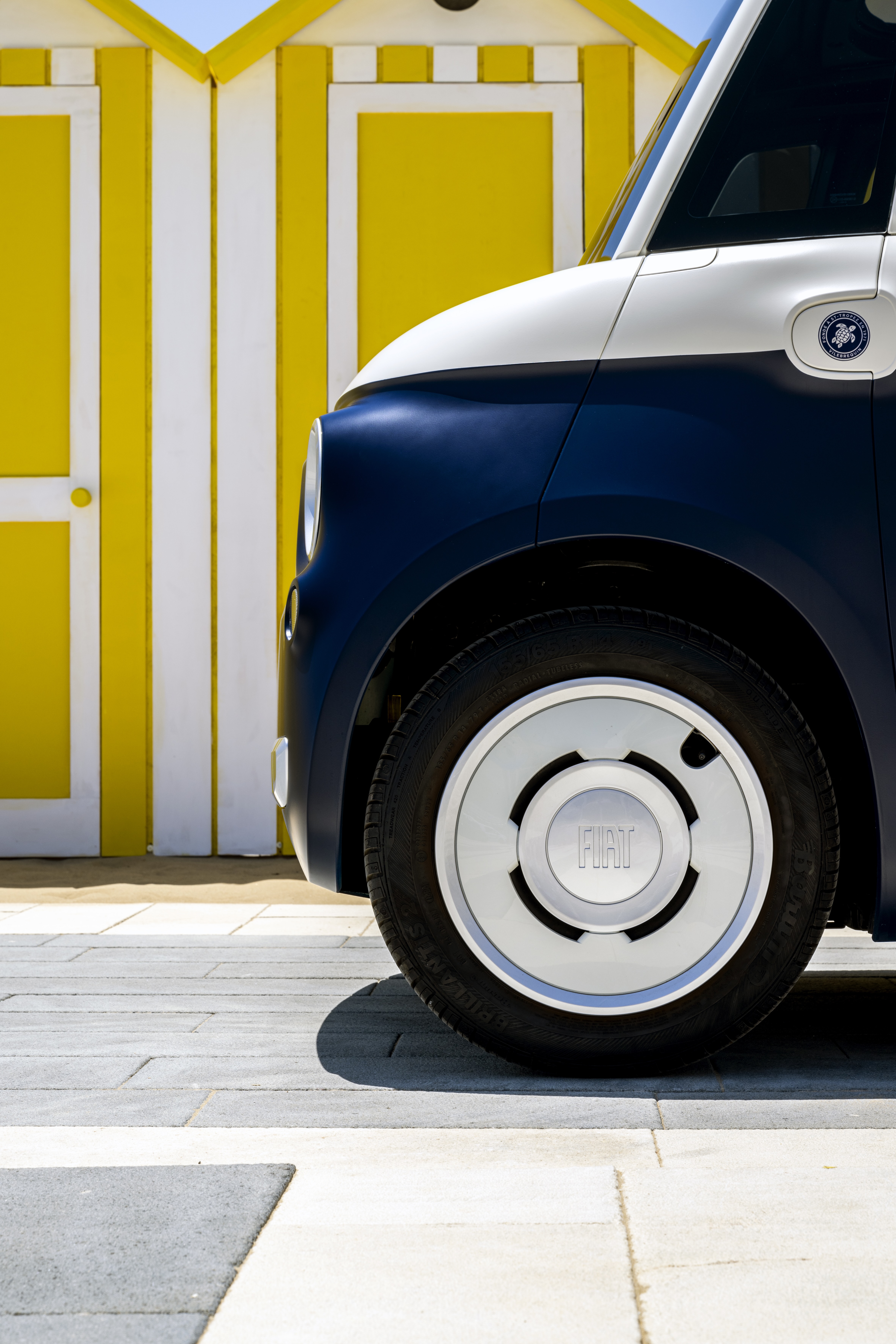 Tiny navy and white car