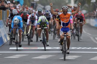 Oscar Freire crosses the finish line of the 101st Milan-San Remo spring classic in victory on March 20, 2010