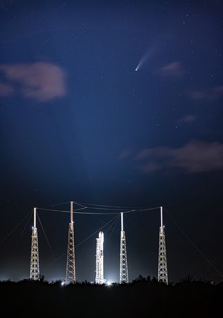 Comet NEOWISE shines above a SpaceX Falcon 9 rocket on the pad at Cape Canaveral Air Force Station in Florida. SpaceX posted this photo on Twitter on July 20, 2020, the same day that the Falcon 9 is scheduled to launch the South Korean military satellite Anasis 2.