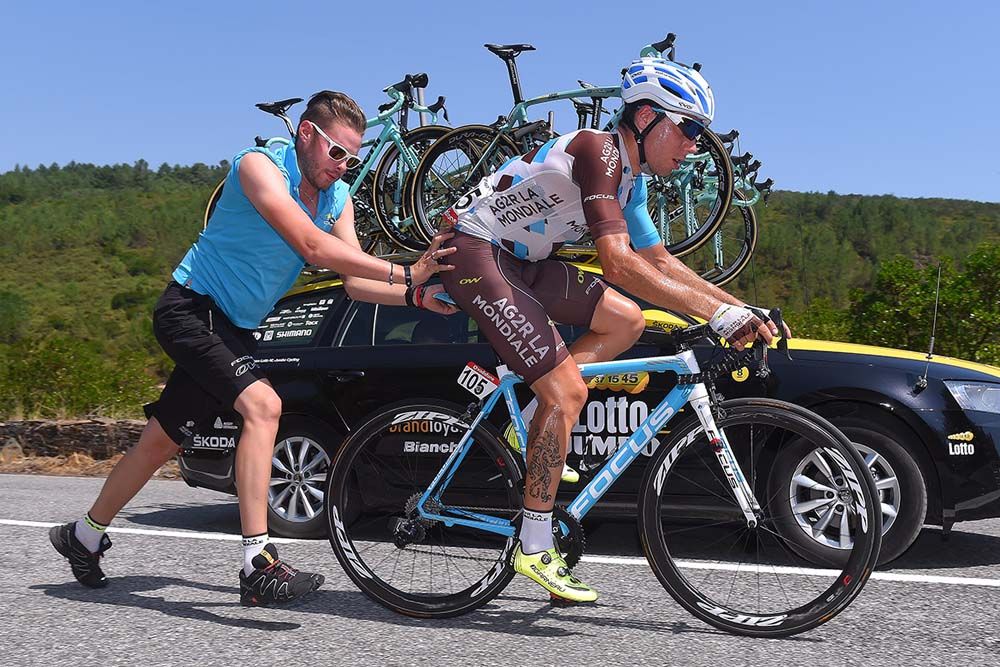Francois Bidard (AG2R-La Mondiale) gets a push off