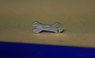 a valve key. pliers can also be used