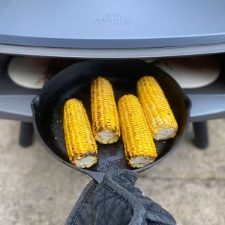 corn cooked in a pizza oven