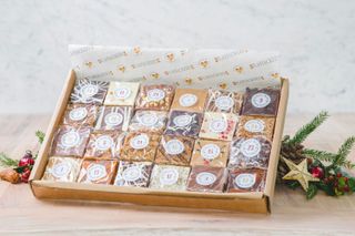 Flapjackery advent calendar presented in a box with individually wrapped numnbered flapjack squares