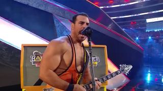 Rick Boogs playing guitar at WrestleMania 38.