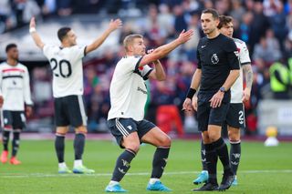 Matthijs de Ligt remonstrates with referee David Coote