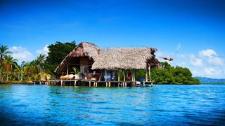 Wooden holiday accomodation on stilts in the sea