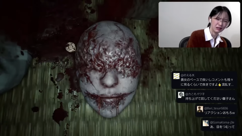 Japanese actor Konatsu Kato reacting with disgust to a gruesome face uncovered in silent hill f gameplay.
