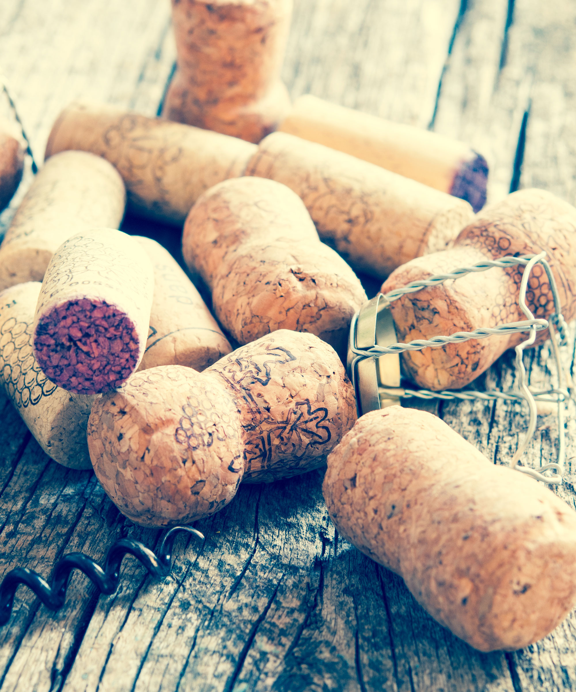 wine corks in pile on kitchen table