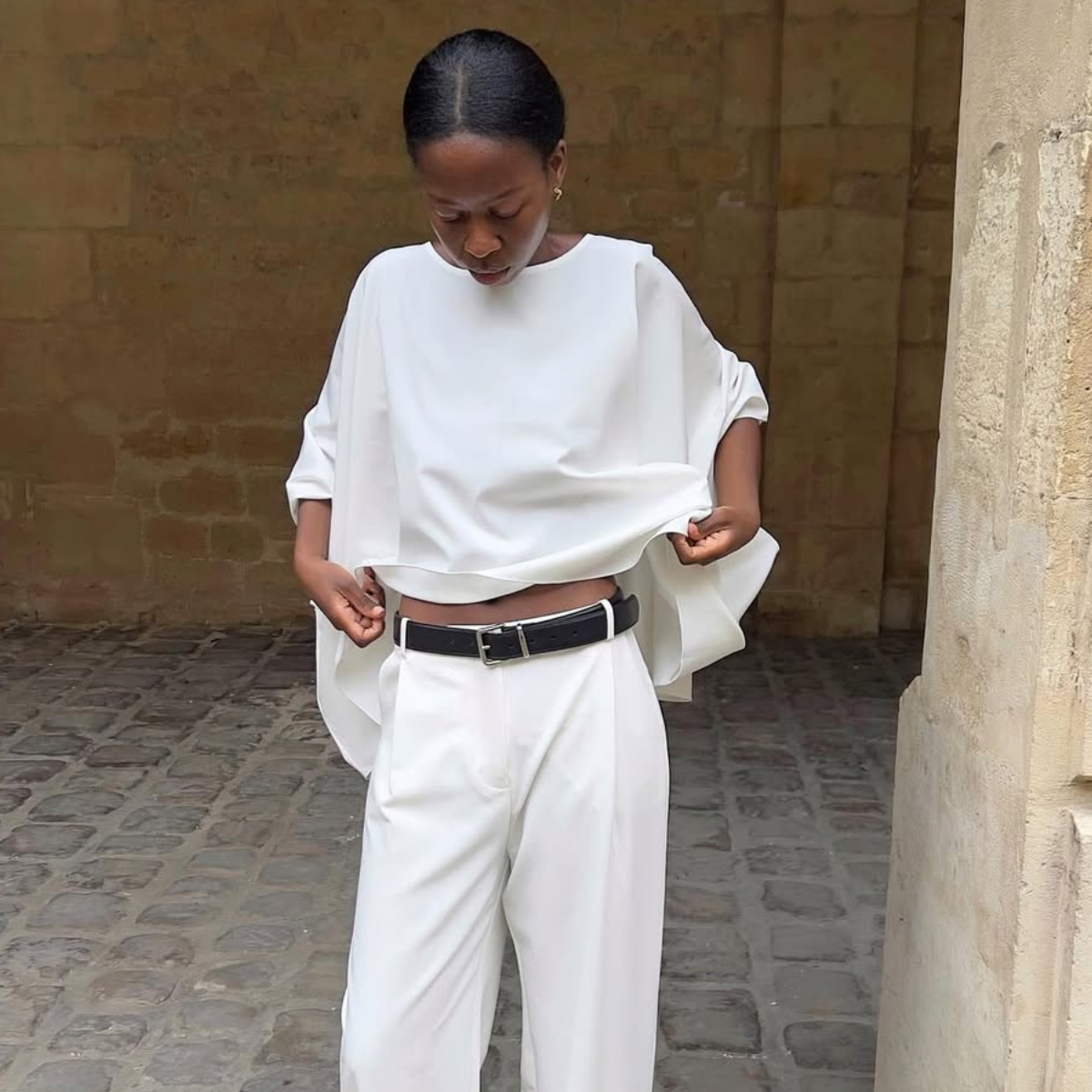 Sylvie in darted white trousers