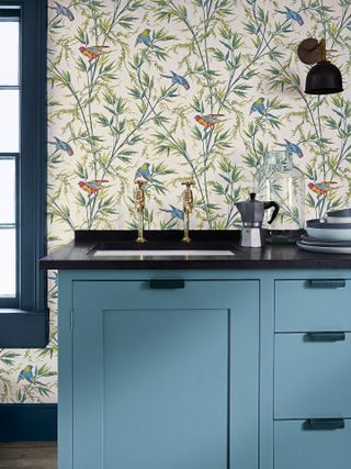 Blue worktop with floral cream wallpaper