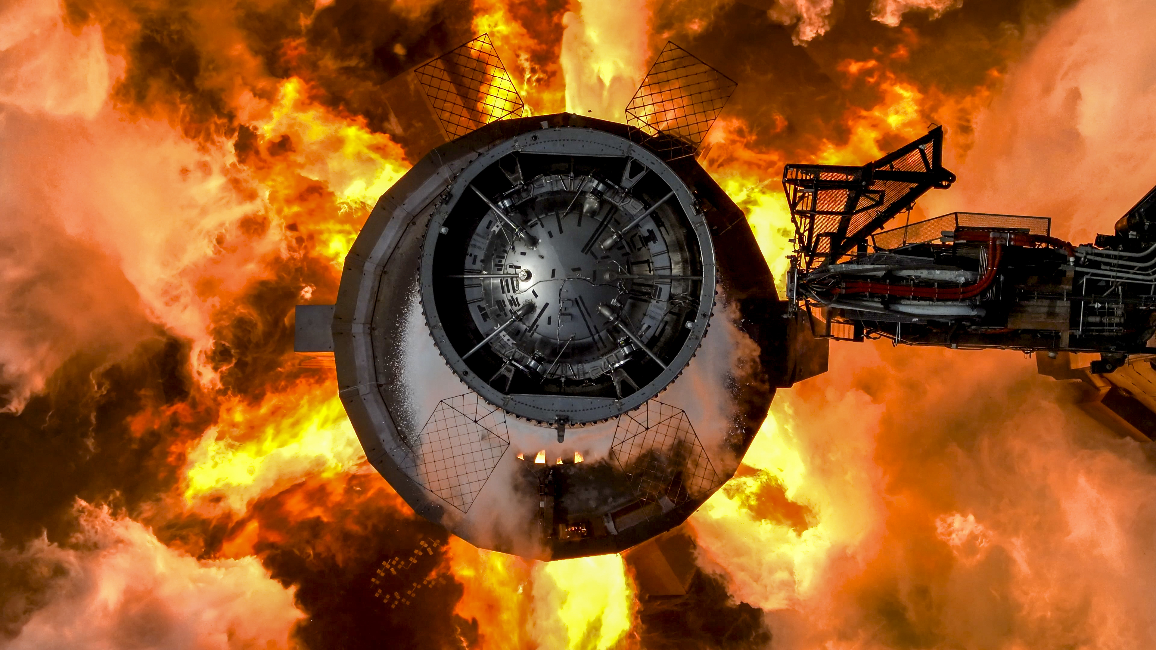 A top-down view of SpaceX's mighty Starship Super Heavy booster during an engine test.