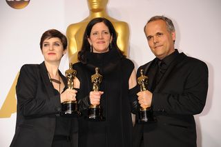 Mathilde Bonnefoy, director Laura Poitras, and Dirk Wilutzky, winners of best Documentary Feature Award for Citizenfour pose at the 87th Academy Awards