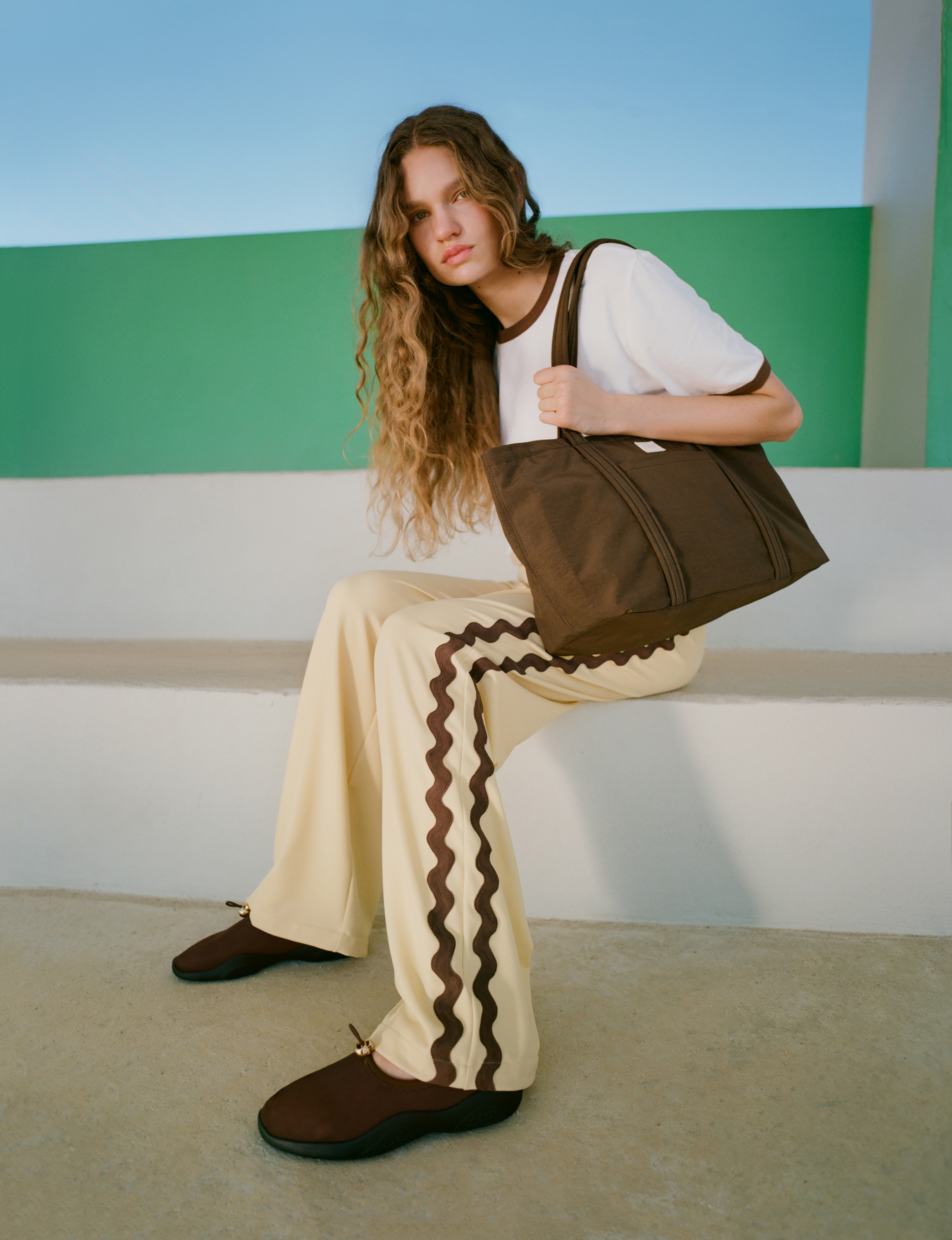 Loeffler Randall model poses in green shoes
