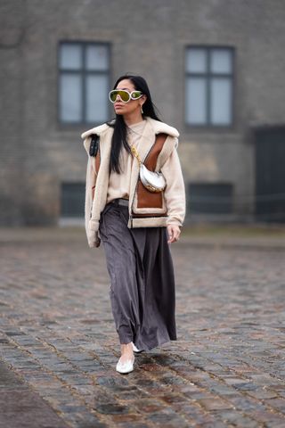 Woman in shearling vest