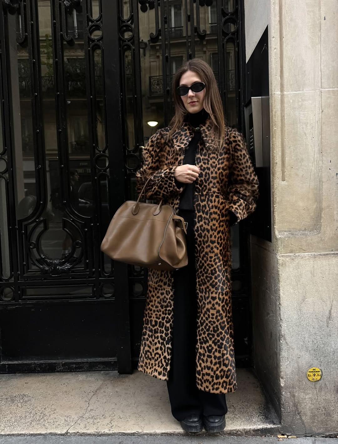 Olivia Wayman wearing a By Malene Birger leopard-print coat.