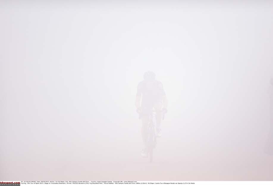 Can you guess who it is? Salvatore Puccio rides through the mist at the Vuelta a Espana