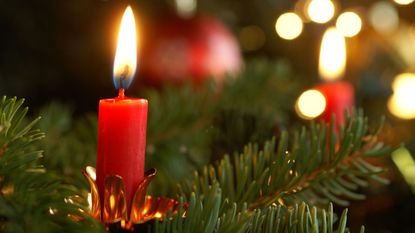Can you put real candles on a Christmas tree? A lit candle on a Christmas tree