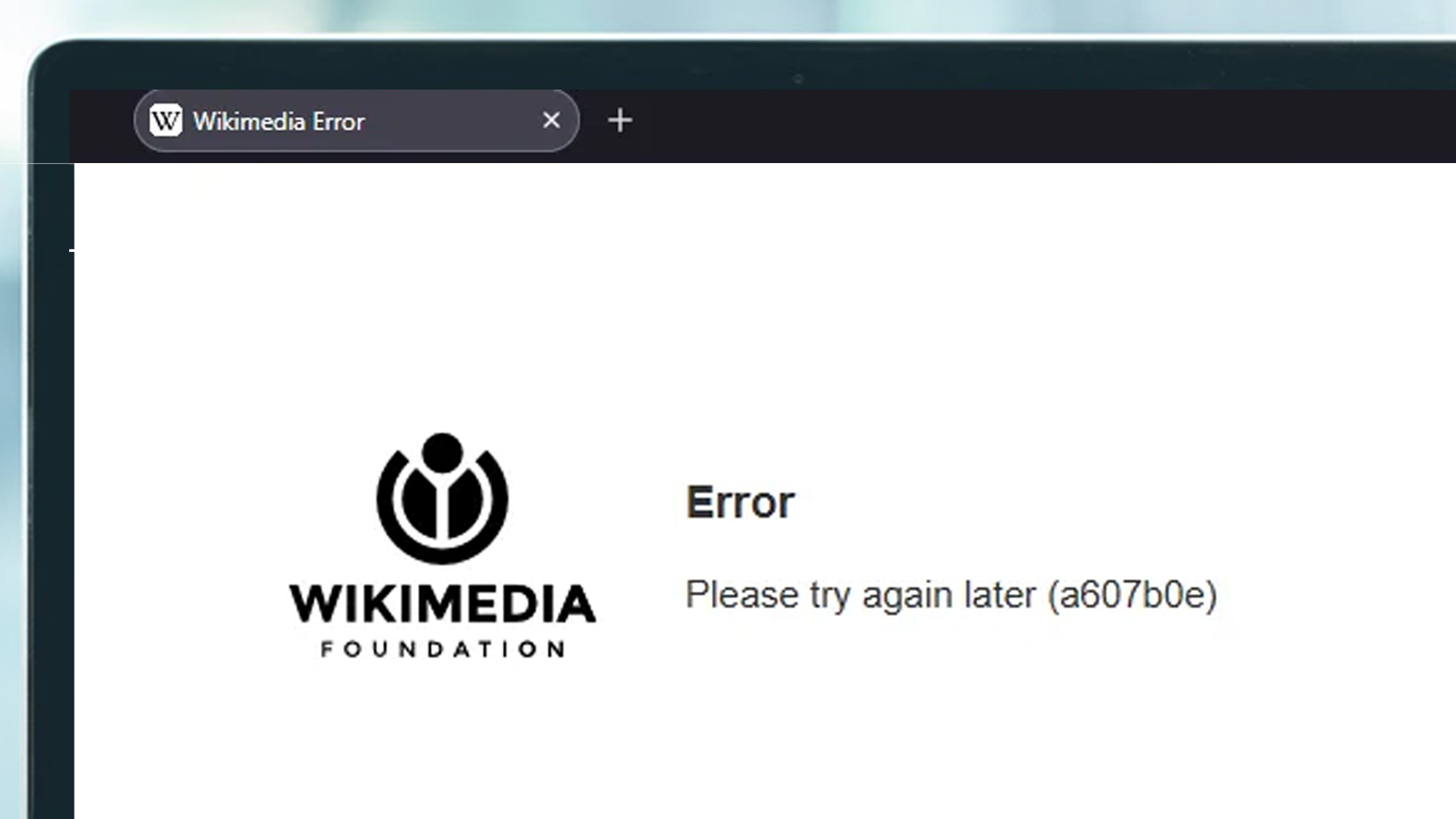 A laptop screen showing the Wikimedia website being down