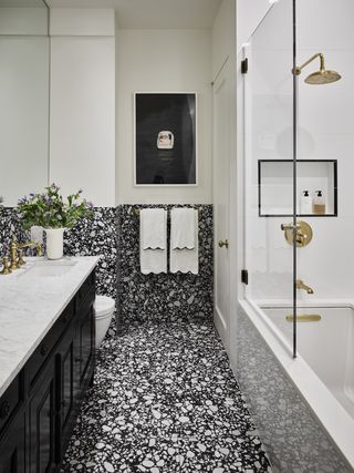 Black and white bathroom with terrazzo flooring